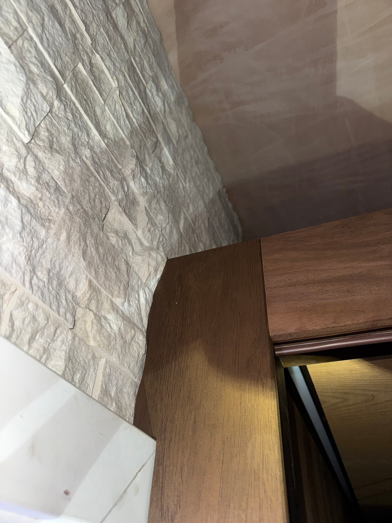 Timber entrance trim fitted around the existing stone wall