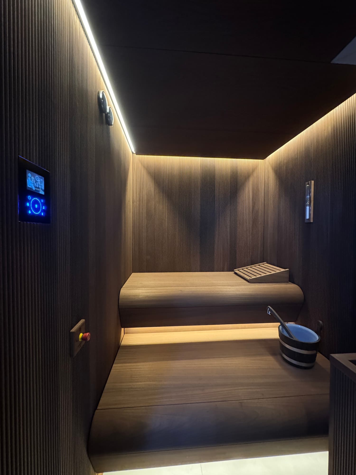 Completed Dartmouth sauna with illuminated benches and touchscreen controls