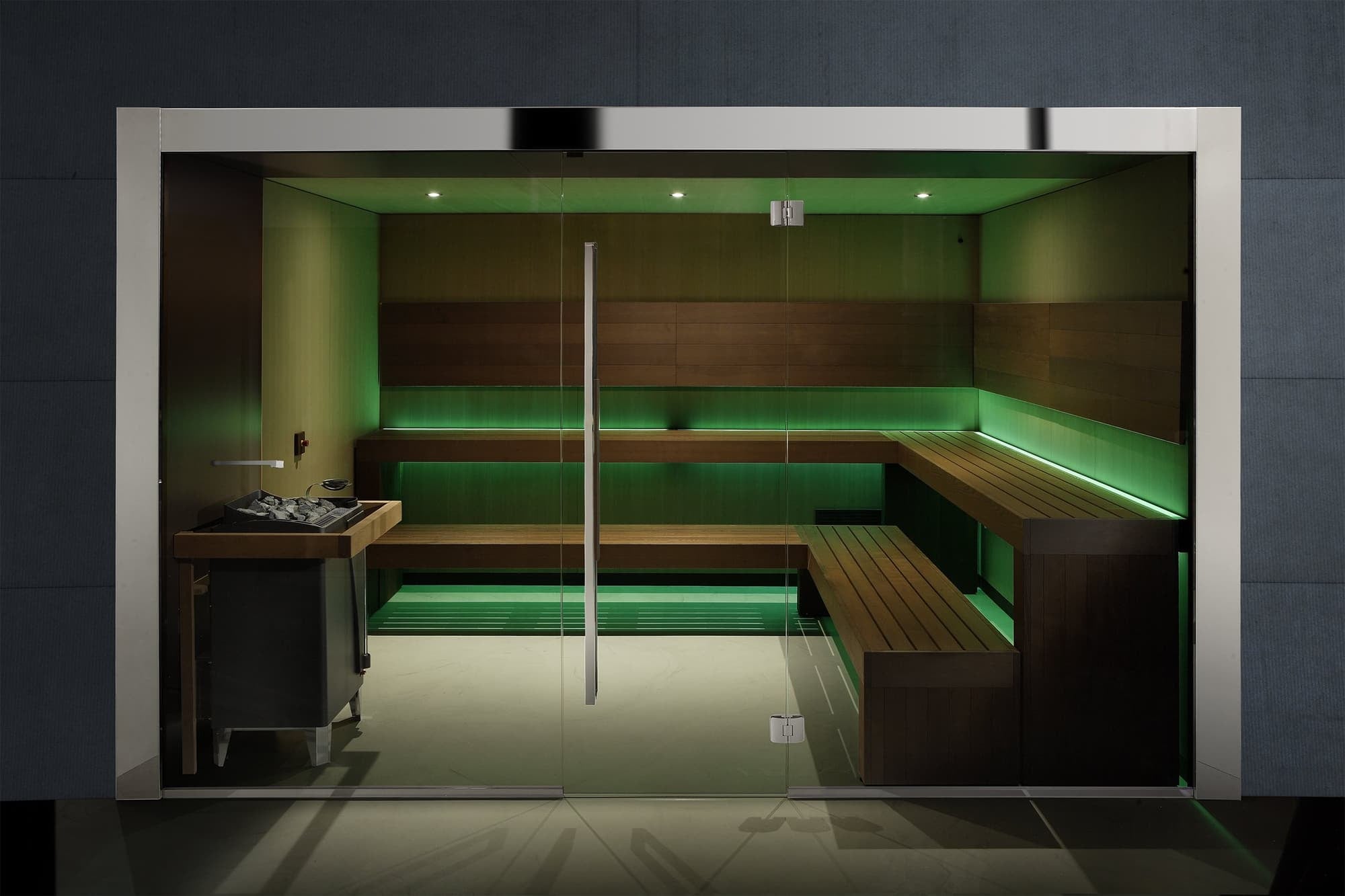 Glazed sauna with tiered benching and green perimeter lighting
