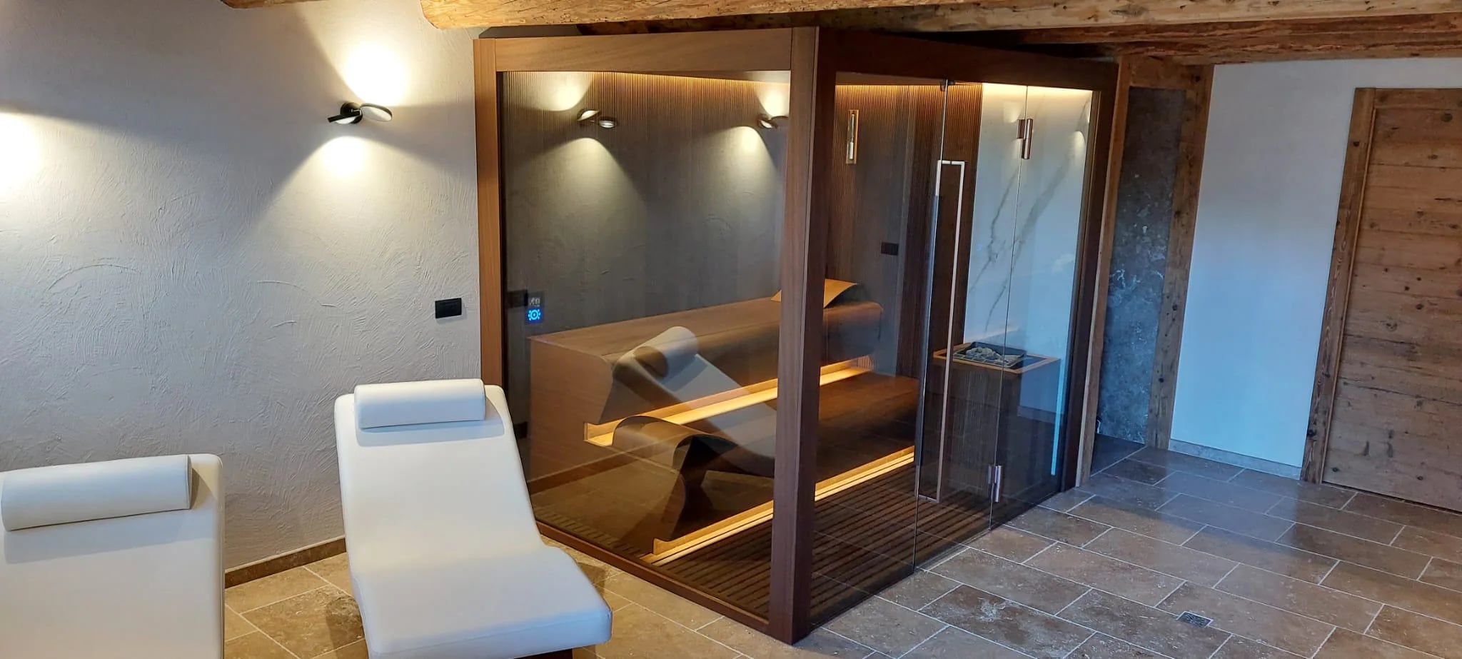 Angled view of an installed INFINITY sauna and lounger
