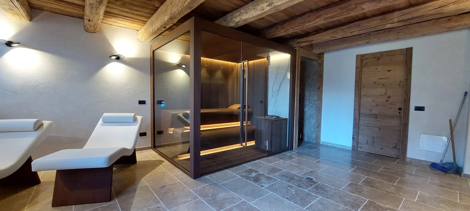 Completed wellness room with an INFINITY sauna and relaxation seating