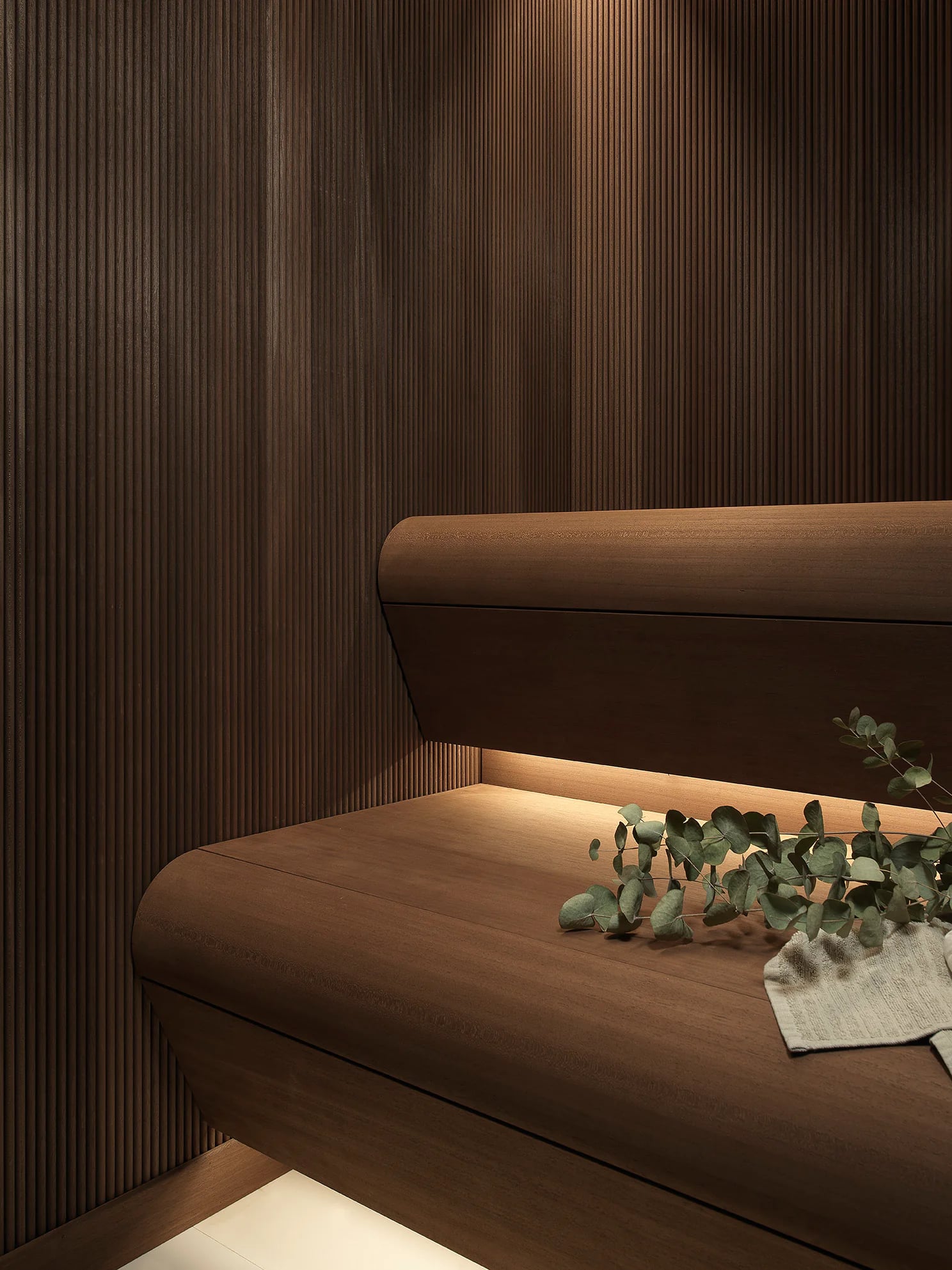 Dark timber bench and concealed lighting detail