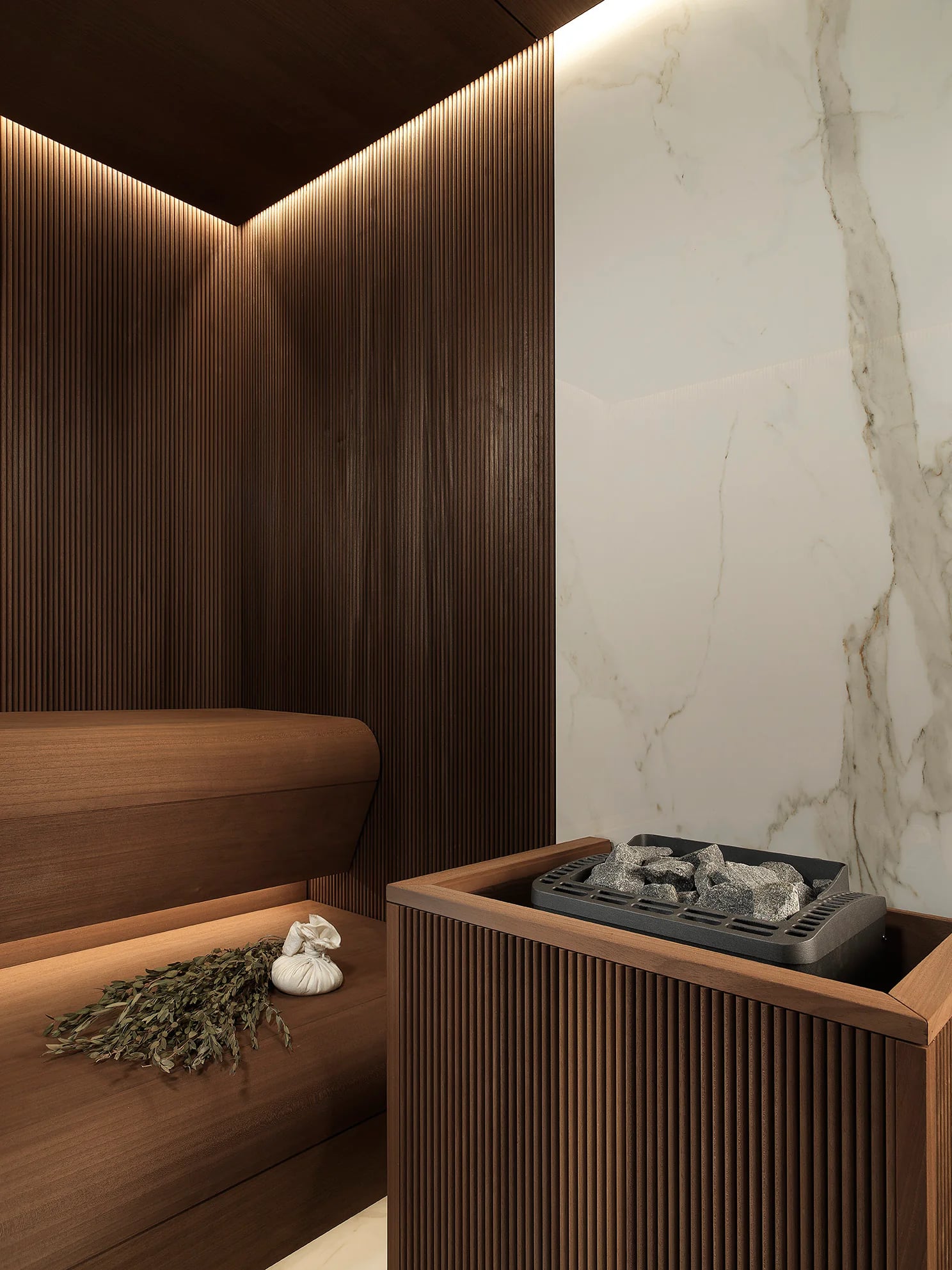Sauna heater, stones and timber bench detailing