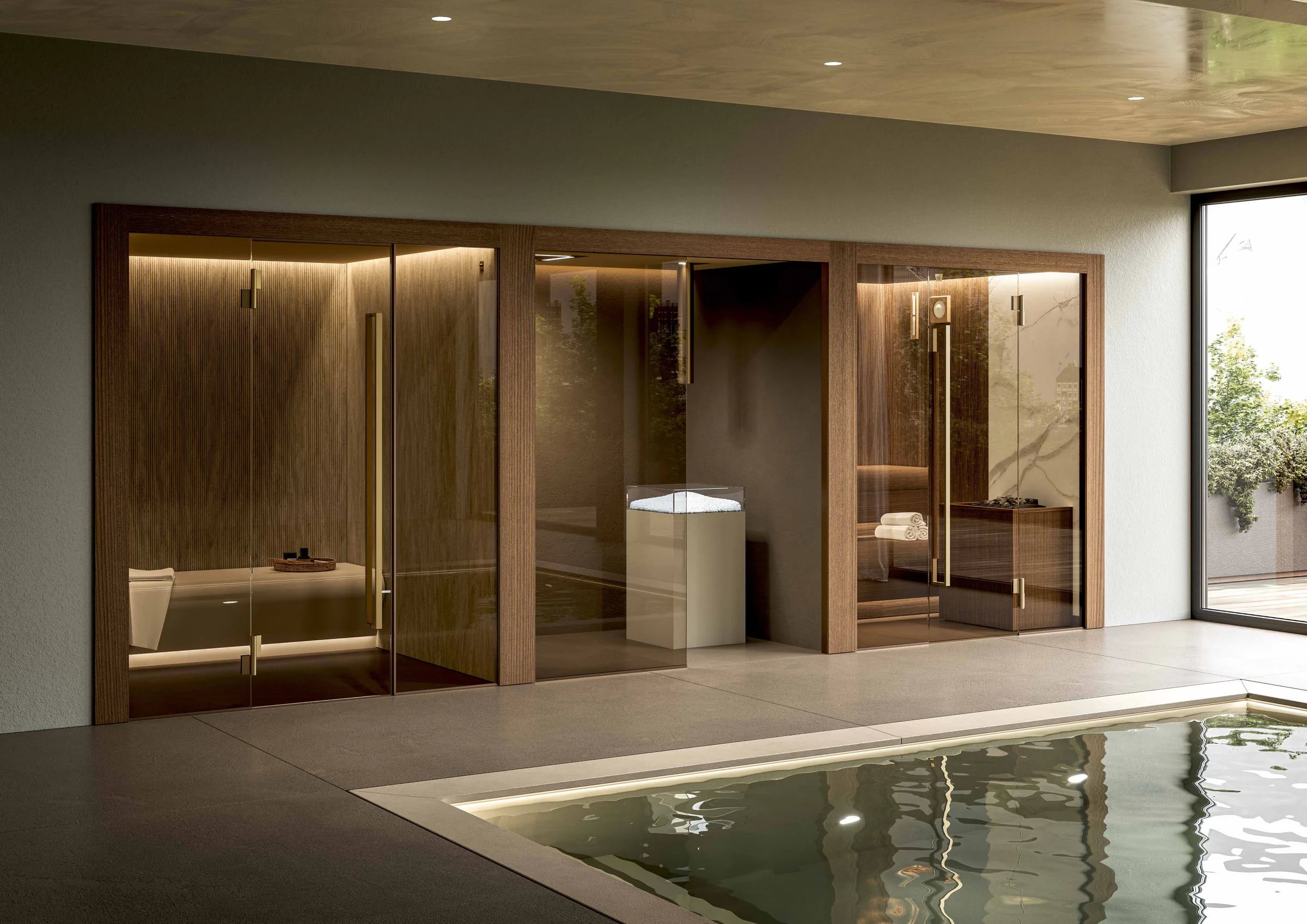 Complete INFINITY sauna and steam room suite beside an indoor pool
