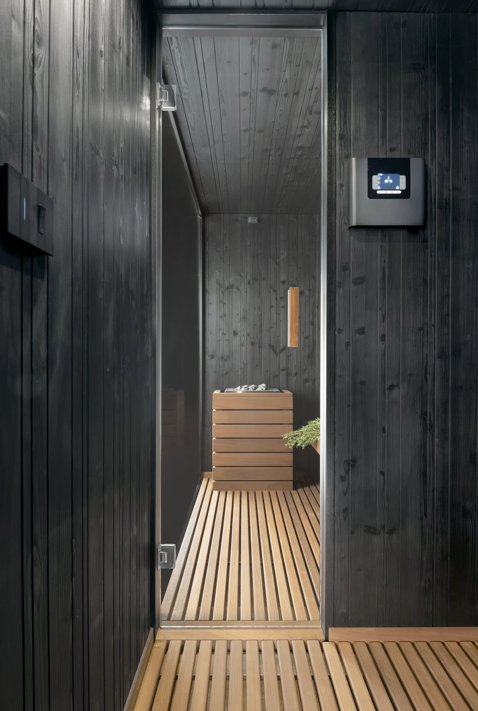 Integrated controls inside an outdoor sauna cabin