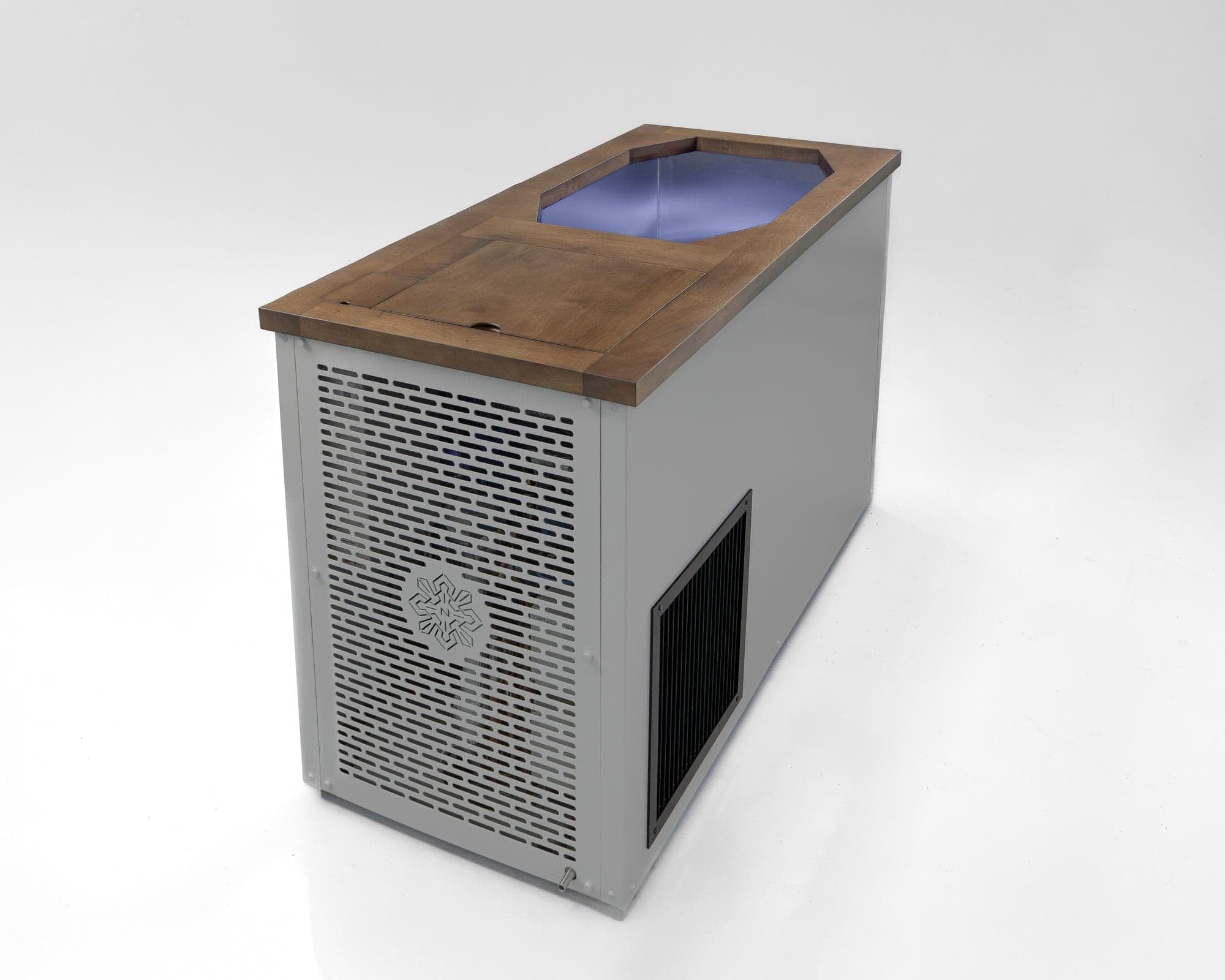 Rear of the Nebula cold plunge, showing the chiller vent and grille