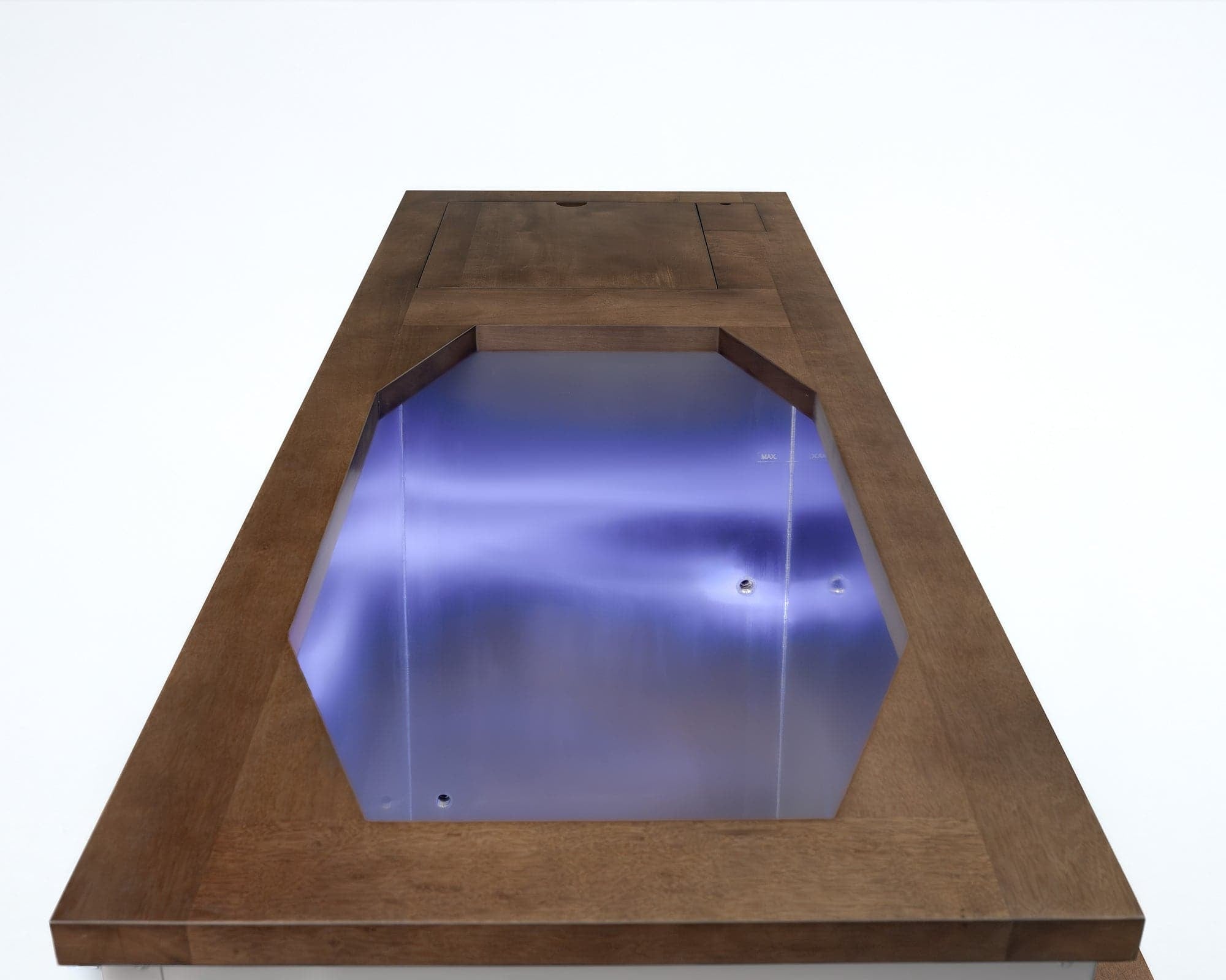 Looking down into the plunge: stainless tub, teak surround, lit interior